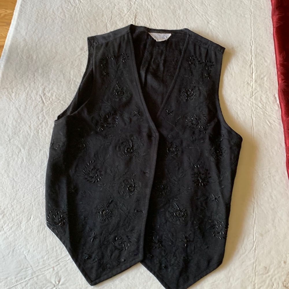 Lightly beaded black vest. Great with jeans or skirts dressy or casual small